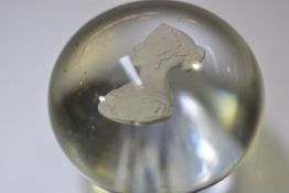 A 19th century clear glass sulphide paperweight, with a portrait bust of the young Queen Victoria.