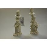 A pair of Stevenson & Hancock, Derby, figural candlesticks, c. 1865, glazed in the white and in