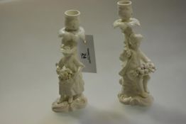 A pair of Stevenson & Hancock, Derby, figural candlesticks, c. 1865, glazed in the white and in