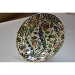 An Iznik pottery dish, Turkey, probably early 18th century, the well with characteristic