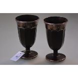 A pair of Continental amethyst glass silver overlay vases, early 20th century, of faceted goblet