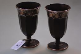 A pair of Continental amethyst glass silver overlay vases, early 20th century, of faceted goblet