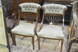 A pair of Edwardian inlaid rosewood drawing room chairs, each with buttoned upholstered crest rail