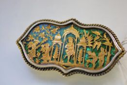 An Indian Thewa art brooch, possibly Partabargh, c. 1880, of shaped oval form, decorated with gilt