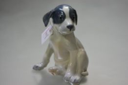 A large Royal Copenhagen porcelain model of a seated puppy, model no 259, 21cm