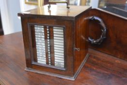 A late 19th century mahogany table top collector's cabinet, with gilt-brass handle and a single