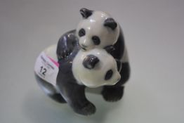 A Royal Copenhagen porcelain group of young pandas, model no. 667. Height 9cm