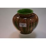 Richard Amour for Bough Pottery, a globular vase, glazed with streaks of brown, green and cream,