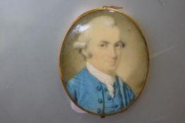 English School, c. 1780, a portrait miniature of a gentleman in a blue coat, watercolour on ivory,