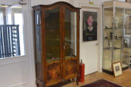 A gilt-metal mounted walnut Vernis Martin display cabinet, c. 1900, the arched crest rail above a