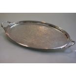 A silver tea tray, Mappin & Webb, Sheffield 1974, oval, with channelled rim and twin loop handles.