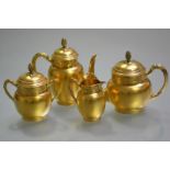 A handsome French silver-gilt four piece tea and coffee service, 19th century, in the Empire