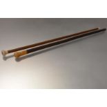 A late 19th century ivory handled walking cane, the handle carved and incised with a stylised