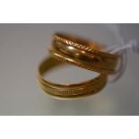 Two high carat yellow gold rings, one with stamped marks including 916 (22ct), the other with rubbed