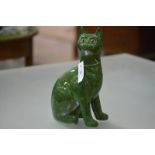 A Griselda Hill for Wemyss Pottery model of a seated cat, glazed in mottled green, with glass