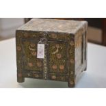 An Indian painted wooden box, the hinged cover decorated with a cartouche of tea pickers, the
