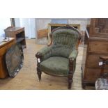 A mid-Victorian walnut framed armchair, the shaped buttoned back with foliate carved crest rail,