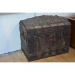 An early 19th century leather-covered dome-top trunk, the cover, front and sides with elaborate