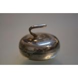 A George V silver box modelled as a curling stone, hallmarked for James Fenton, Birmingham 1913.