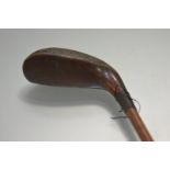 A Robert Forgan dark stained beech longnose putter, stamped maker's mark, shaft shortened. Length