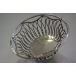 A George V silver bread or fruit basket, Pairpoint Brothers, London 1910, circular, with wirework