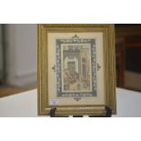 An Indian watercolour on ivory, depicting an enthroned ruler, with inscription and signature, within