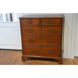 A George III oak chest of drawers, late 18th century, the rectangular moulded top above two short