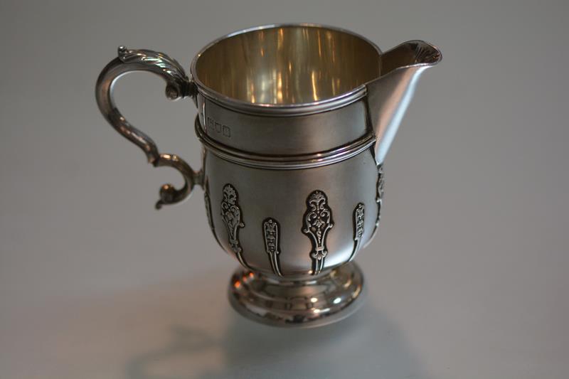 A good Edwardian silver cream jug, Thomas, Walter and Henry Holland, London 1898, in early 18th
