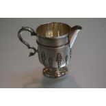 A good Edwardian silver cream jug, Thomas, Walter and Henry Holland, London 1898, in early 18th