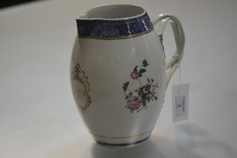 A Chinese Export porcelain cider or ale jug, c. 1800, of barrel form, with crossed strap handle,