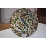 An Iznik pottery dish, Turkey, probably early 18th century, the well with characteristic