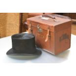 A gentleman's black silk top hat (approx. size 7), in a fitted leather case, maker's label R.K.