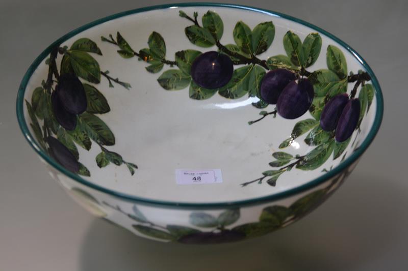 A Wemyss pottery wash bowl, painted in the purple plums pattern, impressed mark for Wemyss and