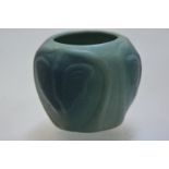 An American Arts & Crafts pottery vase by Van Briggle, of squat spherical form, moulded with