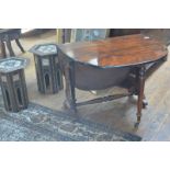 A good mid-Victorian rosewood Sutherland table, the boldly figured top with shaped leaves, raised on