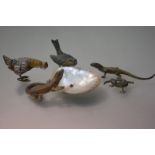 A group of early 20th century cold-painted metal animal and bird models including lizards and a