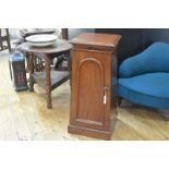 A mid-Victorian mahogany bedside or pot cupboard, the square moulded top over a tapering case with