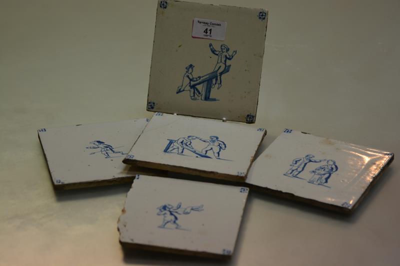 A set of five Delft blue and white tiles, 19th century, each depicting children at play and with