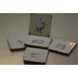 A set of five Delft blue and white tiles, 19th century, each depicting children at play and with