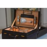A 1930's lady's travelling dressing case, the blue morocco case bearing owner's monogram "IW" and