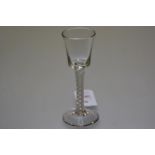 A wine glass, c. 1760, the bucket bowl raised on a double series airtwist stem and domed foot. 15cm