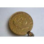 A George III gold full sovereign, 1820, with pendant mount. Gross weight 8.4 grams