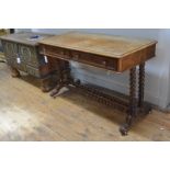 A mid-Victorian walnut writing table, c. 1860, of rectangular form, with rounded corners, the