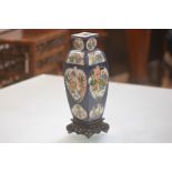 A Chinese porcelain faceted baluster vase, early 20th century, each of the four sides painted with