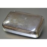 An Edwardian silver table top cigarette box with Boer War inscription (en suite with the two