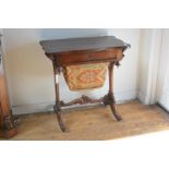 A William IV rosewood work table, the cartouche top over a frieze drawer above a sliding work box,