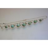 An Edwardian blister pearl and turquoise fringe necklace, the graduated circular turquoise cabochons