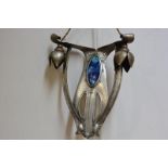 An Art Nouveau hammered metal twin-light wall sconce, the pierced backplate inset with a large