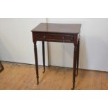 An early 19th century mahogany occasional table, the crossbanded rectangular top over a fielded