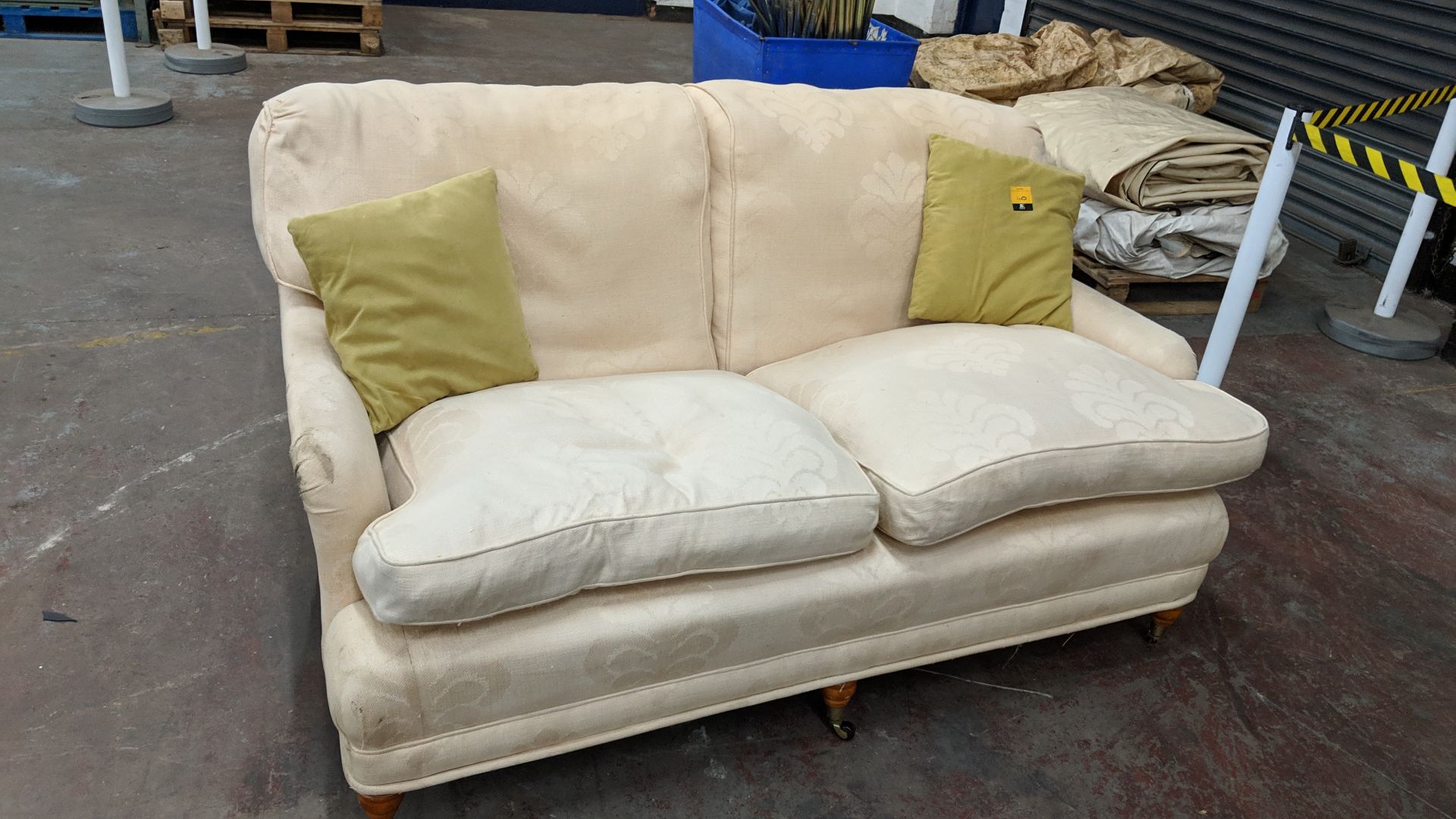 Cream patterned sofa with wooden legs & contrast colour scatter cushions IMPORTANT: Please